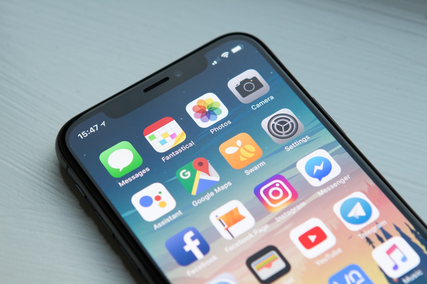 Someone checking a website on a phone — most UAE first impressions happen on a small screen