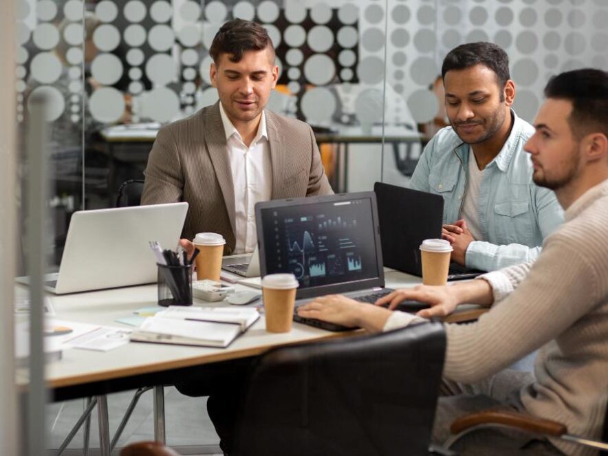 Choosing Software Developer Dubai A professional business consultation meeting in a modern Dubai corporate boardroom discussing software requirements.