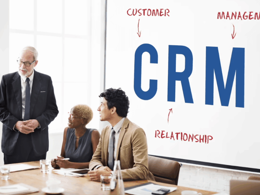Custom CRM Dubai Growing Businesses A growing business team analyzing customer data and sales pipelines on a custom CRM dashboard in a modern Dubai office.